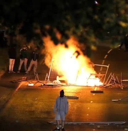 A barricade is set alight at Fahan Street in the Bogside area of Londonderry as disorder flared in the city for a sixth successive night. Pic: Brian Lawless/PA Wire