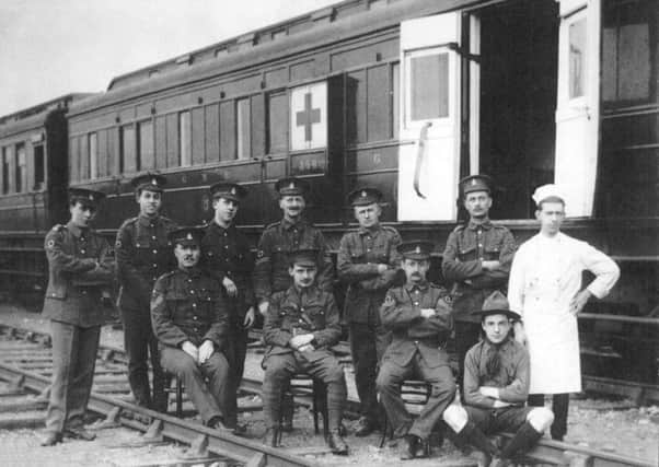Belfast's Number 13 Ambulance Train at Clones in 1915 with RAMC crew and local boy scout