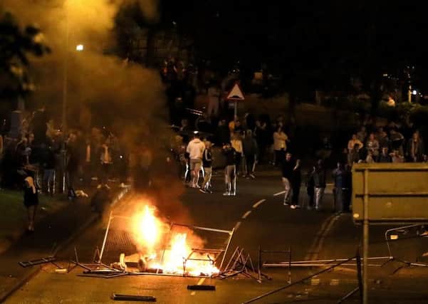Youths in Londonderry's Bogside who petrol bombs at police and random passing vehicles and also lit a fire on a main flyover. Photo: Brian Lawless/PA Wire