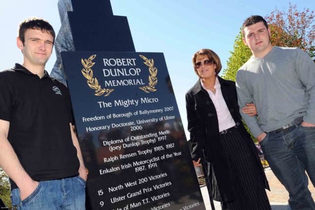 Louise Dunlop with her sons William and Michael at the Robert Dunlop memorial in Ballymoney.