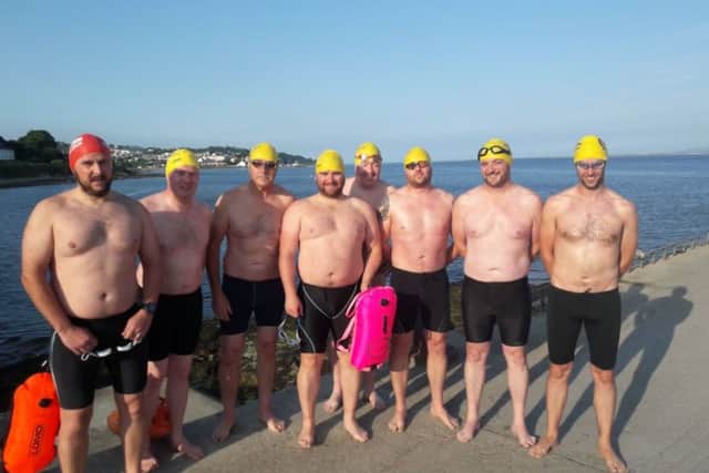 Eight members of the City of Derry Swimming Club who are taking on the North Channel. Gerard Curran is on the far right.