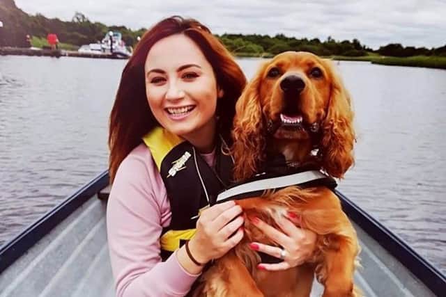 News Letter reporter Kathryn McKenna with her dog, Dougal, during a boat trip at Crom Castle Estate