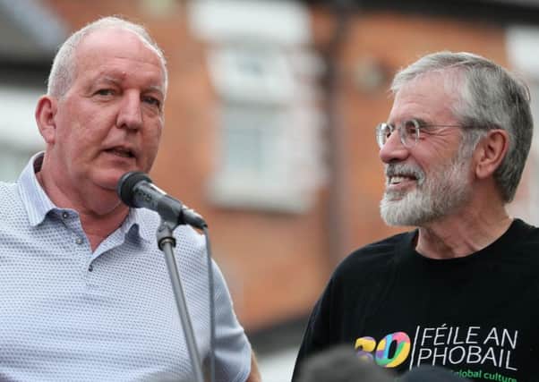 Ex-IRA prisoner and former Sinn Fein chairman Bobby Storey with Gerry Adams at Mondays west Belfast rally where the attacks were denounced