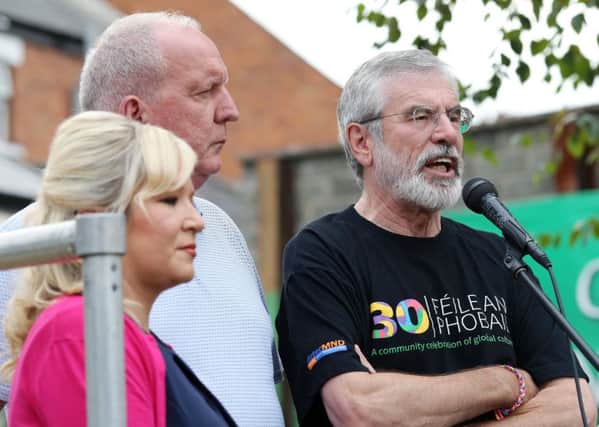 Gerry Adams and Bobby Storey were joined by Sinn Fein's Northern Ireland leader Michelle O'Neill at a protest rally against the attacks on Monday evening.