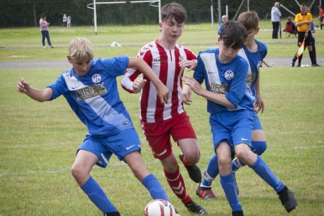 Resolute defending by Ballymoney Academy during Tuesday's O'Neill's Foyle Cup U-14 game against Derry Colts at Thornhill.