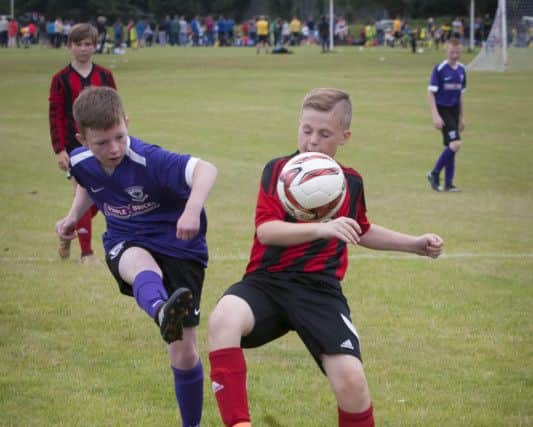 Action from Hillsborough Boys (Lisburn) and Larne Youths at Templemore Sports Complex during Tuesday's O'Neill's Foyle Cup.