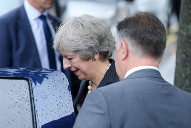 PM Theresa May in Belfast. Photos: Press Eye