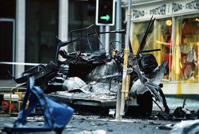 The scene Market Square in Lisburn in 1988 after the IRA planted a 7lb semtex bomb under an army Transit van, killing six soldiers from Londonderry who were taking part in charity fun run. Photo: Pacemaker