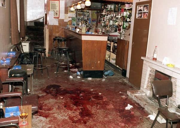 The scene inside the Heights Bar in Loughinisland after UVF gunmen murdered six men who were watching a World Cup football match in June 1994.