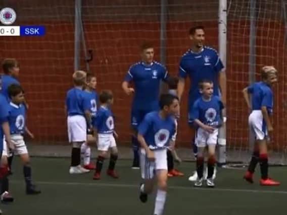 Rangers players went up against soccer school kids.