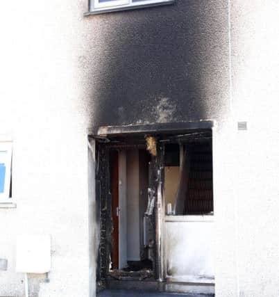 The front door, hallway and exterior of the property were badly damaged. Picture by Jonathan Porter, PressEye