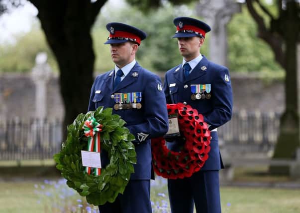 Members of the Irish Air Corps hold wreaths during the ceremony to mark the unveiling of a Victoria Cross Stone in Glasnevin Cemetery, Dublin, dedicated to Major Edward "Mick" Mannock VC. Photo: Brian Lawless/PA Wire