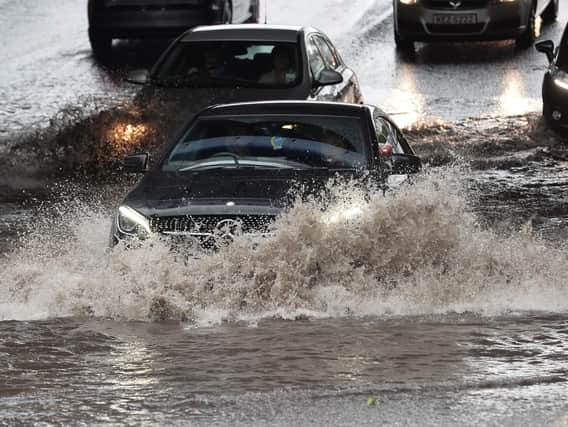Flooding, caused by heavy downpours, has wreaked havoc on Northern Ireland's roads today