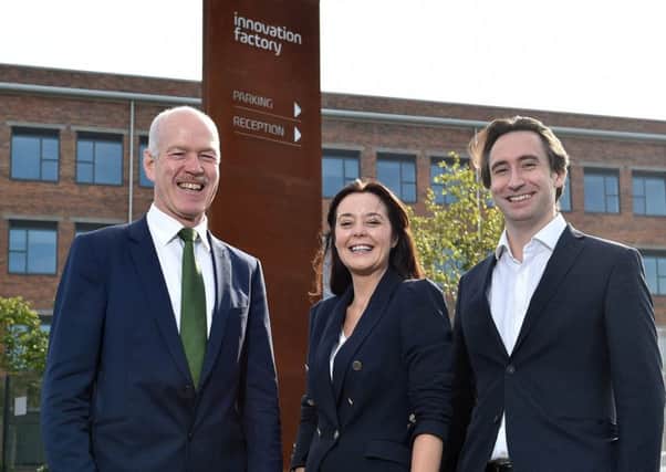 Invest NI director Alan Wilson, left, with Anne-Marie and Marius McGinnis, founders of McGinnis Consulting