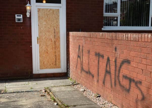 Damage caused to a house on Summer Street in the Oldpark area of North Belfast where a grieving mother was threatened and ordered to leave