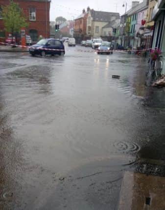 Heavy rainfall flooded roads and footpaths in Dromore town centre on Saturday afternoon.