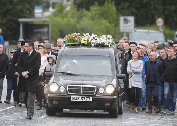 Mourners gathered in Bessbrook for the funeral of father-of-two Brian Phelan, who died following a stabbing incident last week.