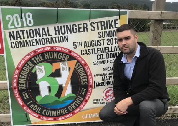 UUP South Down representative Alan Lewis beside a sign erected at Narrow Water to advertise Sinn Fein's National Hunger Strike Commemoration in Castlewellan.