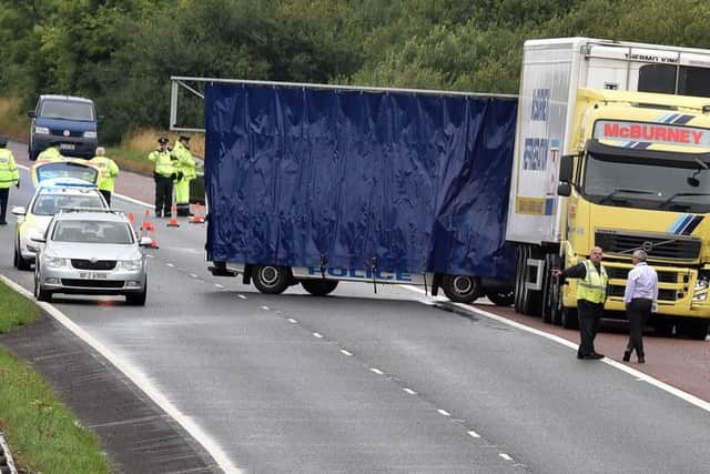Â©Photo by Tonypixnews, 1st Augustl 2018.
A police screen hides the scene of aserious accident on the Belfast bound lane of the M1 on Wednesday afternoon which closed the motorway for some tim between Moira and Lurgan. 
Photo by TONY HENDRON/Tonpixnews.