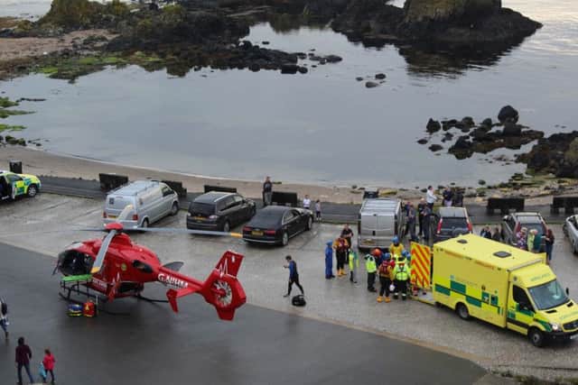 Ballycastle and Coleraine Coastguard teams with Portrush AWLB, Rescue Helicopter 199 from HM Coastguard Prestwick, NI Air Ambulance at Ballintoy Harbour where a person fell this evening. PICTURE PATRICK O BRIEN/MCAULEY MULTIMEDIA