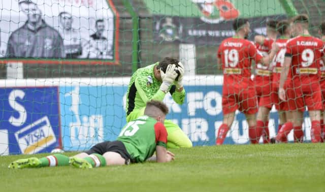 Glentoran's Elliott Morris can't hide his disappointment in losing to a last minute Cliftonville goal. Stephen Hamilton /Inpho