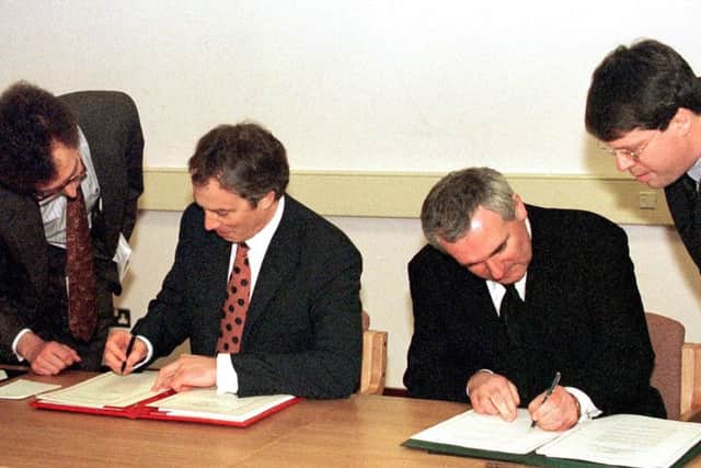 Then prime minister Tony Blair and then taoiseach Bertie Ahern sign the Good Friday Agreement in April 1998