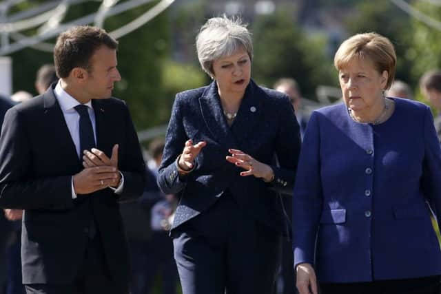 German Chancellor Angela Merkel, right, with French President Emmanuel Macron, left, and UK Prime Minister Theresa May in Bulgaria in May. Chris Moncrieff says: "The EU try to wring every pound of flesh out of Britain, finding fault with any proposal that the Prime Minister puts to them. Despite this, Downing Street say they still hope to leave the EU with a good deal" (AP Photo/Darko Vojinovic)