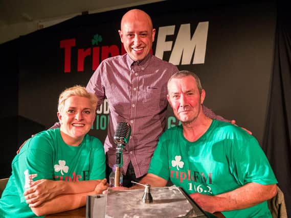 Actors Jo Donnelly (left) and Martin Maguire (right) with writer and director Tony Devlin (centre) after a performance at the Roddy McCorley social club of Tony Devlin's play, "A Station Once Again", remembering the west Belfast radio station, "Triple FM", during 30th year of Feile an Phobail (The Community's Festival) in Belfast
