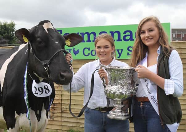Fermanagh Show Queen Megan Morrow presents the Farmers Challenge Cup for the interbreed dairy champion to Ellie McLean from Bushmills