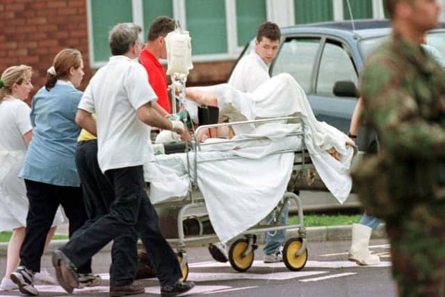 File photo dated 15/08/1998 of an injured casualty being airlifted from Tyrone County Hospital to the Belfast Royal Hospital after a car bomb exploded in the centre of Omagh. A nurse working at the Tyrone County Hospital in Omagh the day of the bomb has recalled it as the "darkest" of her life