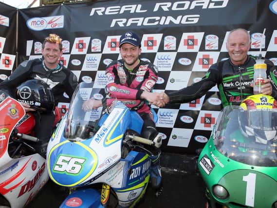Adam McLean (centre) celebrates his Supertwins race win with runner-up Christian Elkin (left) and Ian Lougher.