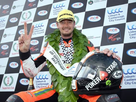 Padgett's Honda rider Conor Cummins celebrates his victory in the Supersport race at the MCE Ulster Grand Prix on Thursday.