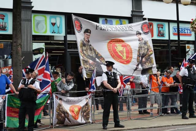 Police separated rival factions during Saturdays anti-internment parade and counter demonstration