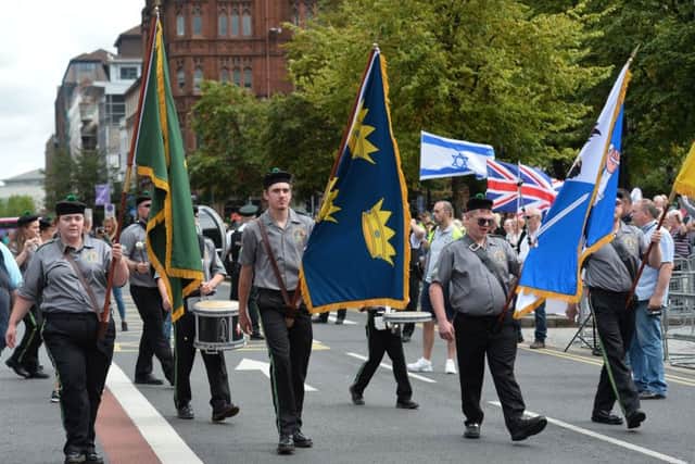 The parade passes Belfast City Hall where a counter demonstration was taking place