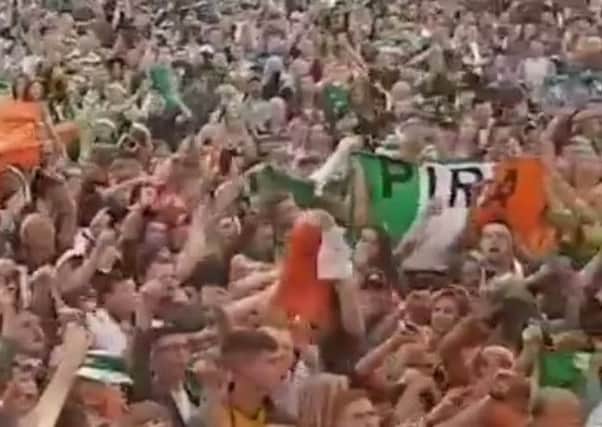 A screen grab from the video showing IRA flags being displayed in the crowd at the Wolfe Tones concert marking the end of Feile an Phobail 2018