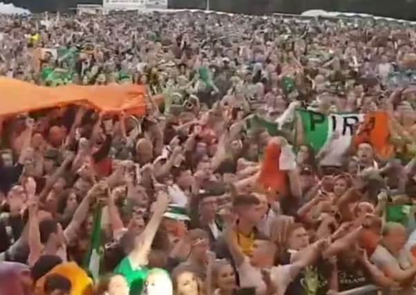 A screen grab from the video showing IRA flags being displayed in the crowd at Falls Park on Sunday
