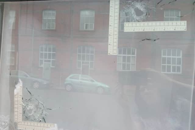 Bullet holes in the window of a house in Lurgan
