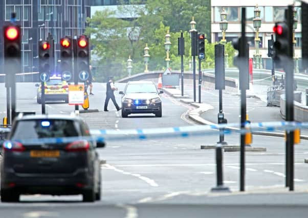 Police activity near the Houses of Parliament, Westminster in central London, after a car crashed into security barriers outside the Houses of Parliament