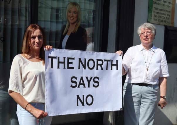 Pro-life campaigners Catherine Sewell (left) and Doris Vincent making their point outside Michelle ONeills constituency office in Coalisland in June