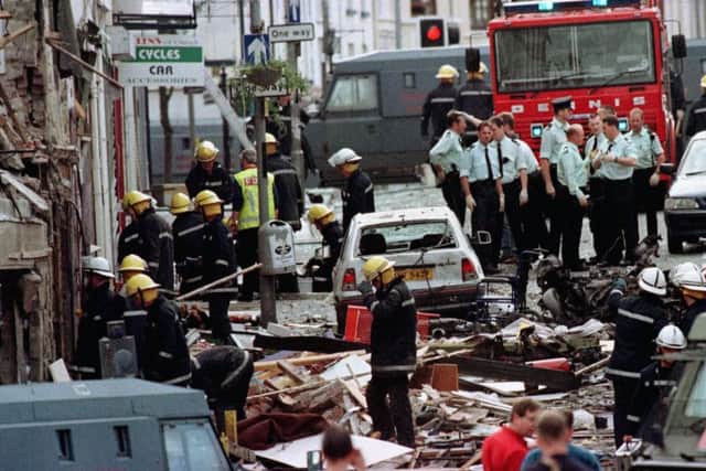 Police officers and firefighters inspecting the damage caused by the dissident Irish republican terrorist car bomb explosion in Market Street, Omagh in August 1998. "In the discussion over whether it could have been prevented or whether it was murder, we should not lose sight of the fact that it was a massacre of civilians carried out by savages". Photo: Paul McErlane/PA Wire