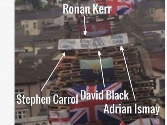 The names of Adrian Ismay, David Black, Ronan Kerr and Stephen Carroll on the Bogside bonfire