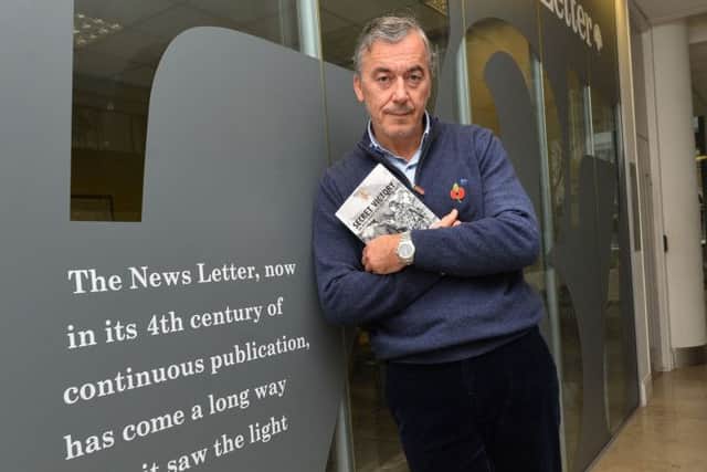 William Matchett at the News Letter Belfast office in 2016 with his book Secret Victory: The Intelligence War that Beat the IRA. 
PPhoto Colm Lenaghan/Pacemaker Press