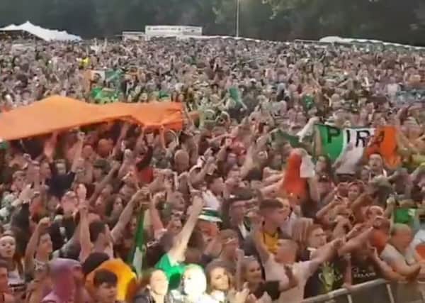 A screen grab from the video showing IRA flags being displayed in the crowd at a music concert marking the end of Feile an Phobail 2018.