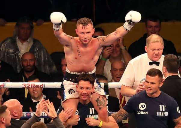 Carl Frampton celebrates victory against Luke Jackson after their WBO Interim Featherweight title fight at Windsor Park, Belfast. Photo: Niall Carson/PA Wire