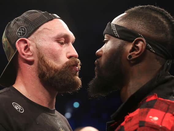 Tyson Fury squares up to WBC World Heavyweight Champion Deontay Wilder in the ring at Windsor Park as their world title clash is confirmed.
