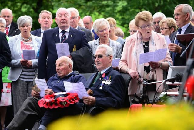 Hundreds of people gathered for the service and unveiling of the memorial