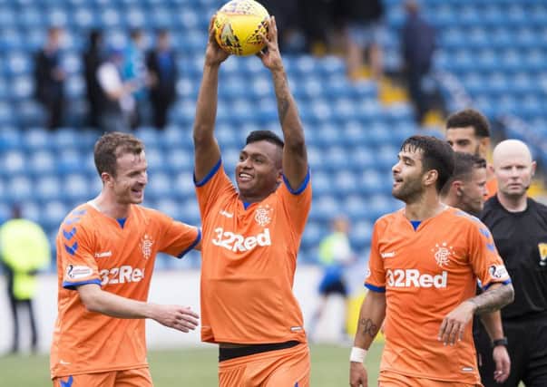 Rangers Alfredo Morelos celebrates with the matchball after scoring a hat-trick against Kilmarnock.