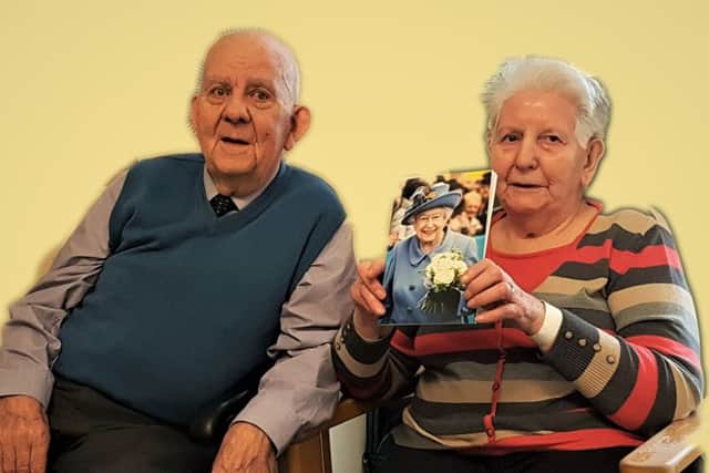 David and Florence Graham with their card from the Queen.