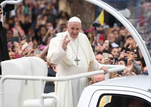 Pope Francis waves to the waiting crowds on College Green, Dublin. Photo: Joe Giddens/PA Wire