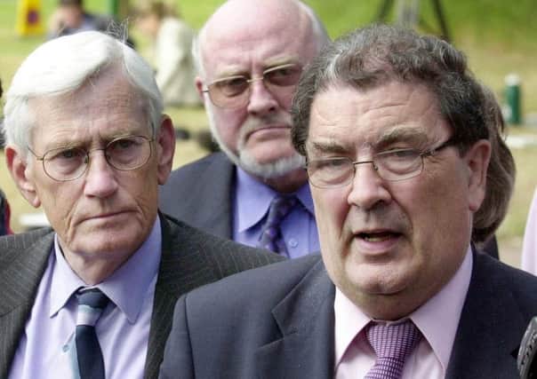 The report said there was a difficult interface between John Hume (right) and Seamus Mallon